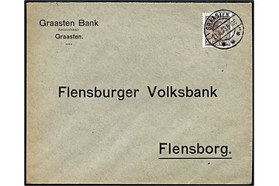 20 øre Chr. X på fortrykt kuvert fra Graasten Bank frankeret som GRÆNESPORTO med brotype IIb Graasten sn2 d. 21.8.1923 til Flensburg, Tyskland.