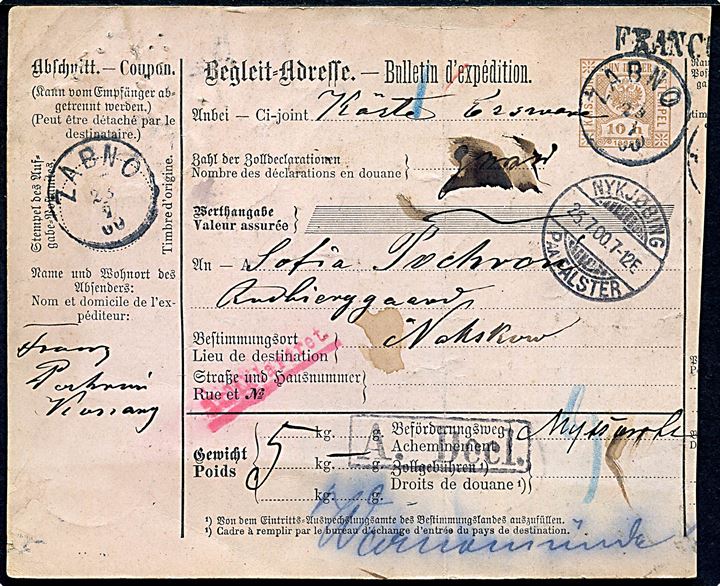 10 k. helsags internationalt adressekort for pakke fra Zabno d. 23.7.1900 via Myslowitz, Warnemünde og Nykjøbing Falster til Nakskov, Danmark. 