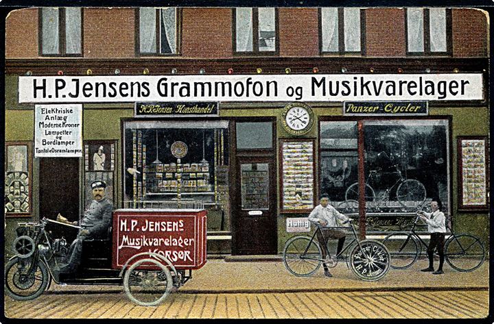 Korsør, H. P. Jensens Grammofon og Musikvarelager med motorcykel. Reklamekort fra H. P. Jensens Forlag. Runde hj.