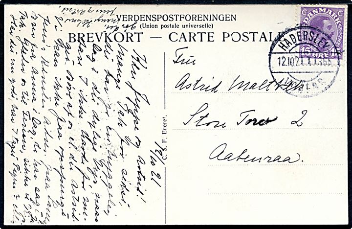 15 øre Chr. X på brevkort (Østerbygaard) annulleret med bureaustempel Haderslev - Vojens T.1355 d. 12.10.1921 til Aabenraa.