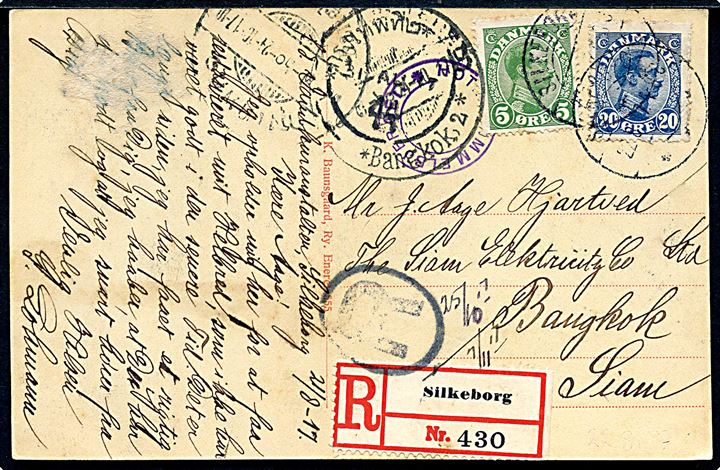 5 øre og 20 øre Chr. X på brevkort (Himmelbjerget) sendt anbefalet fra Silkeborg d. 22.8.1917 til Bangkok, Siam. Ank.stemplet i Siam d. 24.10.1917. Ingen tegn på censur. 