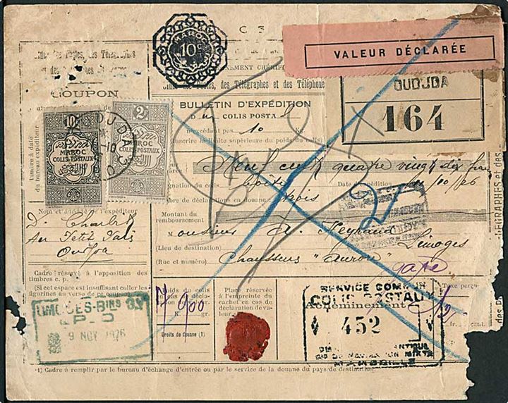 Fransk Marokko. 2 fr. og 10 fr. Pakkeporto på adressekort for værdipakke fra Oudjda d. 11.10.1926 til Frankrig. Papir meget medtaget.
