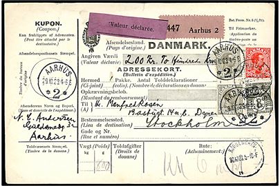 8 øre Bølgelinie, 25 øre og 50 øre (2) Chr. X på 133 øre frankeret internationalt adressekort for værdipakke fra Aarhus *2* d. 29.10.1923 til Stockholm, Sverige.
