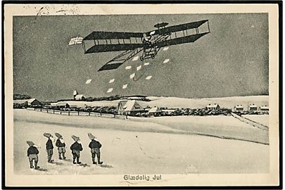 Nisse i Bybillede. Flyver smider post ned til nisser i Sønderjylland. W. Schützsack no. 497a. Med 15 øre Chr. X fra Haderslev til Nysted. Julemærke 1922 bundet til kortet. 