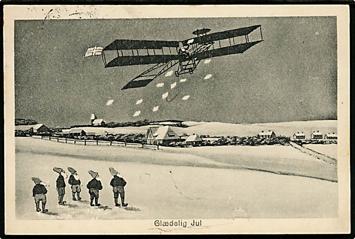 Nisse i Bybillede. Flyver smider post ned til nisser i Sønderjylland. W. Schützsack no. 497a. Med 15 øre Chr. X fra Haderslev til Nysted. Julemærke 1922 bundet til kortet. 