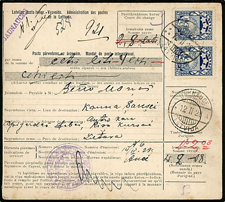 20 s. Våben i parstykke på internationalt adressekort for pakke fra Jaunuces d. 12.2.1938 via Auce, Riga og Kaunas til Šančiai i Lithauen. 