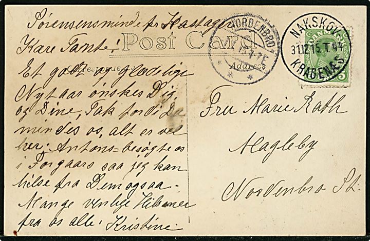 5 øre Chr. X på brevkort (Sørensensminde pr. Kastager) annulleret med smukt bureaustempel Nakskov - Kragenæs T.44 d. 31.12.1915 til Magleby pr. Nordenbro på Langeland. Ank.stemplet Nordenbro d. 1.1.1916.