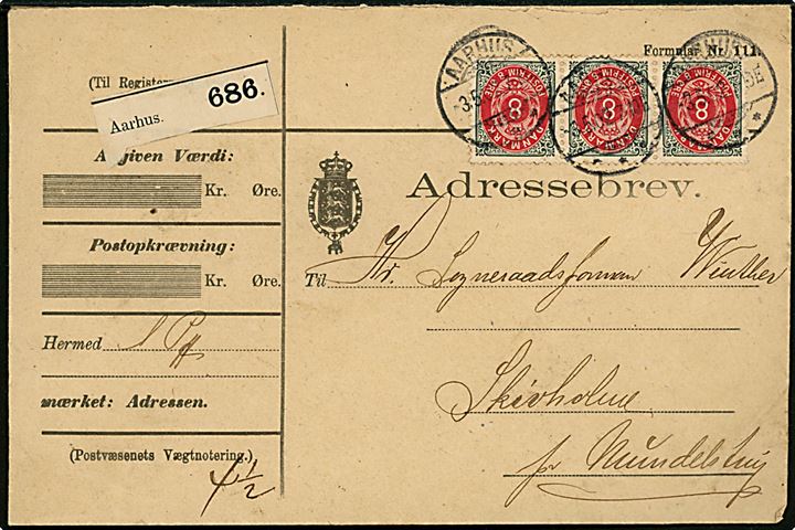 8 øre Tofarvet (3) omv. rm. på 24 øre frankeret adressebrev for pakke fra Aarhus d. 3.5.1902 til Mundelstrup.