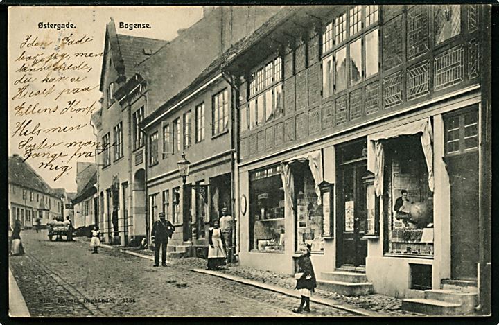 Bogense. Østergade med butikker og postbud. Niels Ehlerts no. 3354.