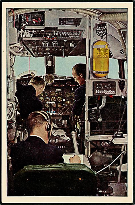 Douglas DC-4. Interiør fra cockpit. Reklamekort fra Det danske Luftfartsselskab DDL u/no.