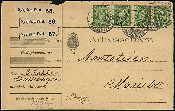 32 øre Tjenestemærke i vandret 4-stribe på BREVFORSIDE af adressebrev for 3 pakker annulleret Nykjøbing paa Falster d. 24.9.1900 til Maribo. 