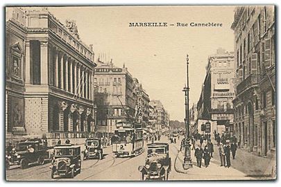 Rue Cannebiere i Marseille, Frankrig med sporvogne og biler. U/no.