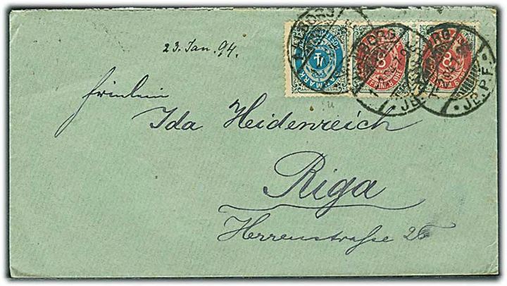 4 øre Tofarvet ret rm. og 8 øre Tofarvet omv. rm. i parstykke på 20 øre frankeret brev fra Aalborg JB.P.E. d. 1.2.1894 til Riga, Letland, Rusland.