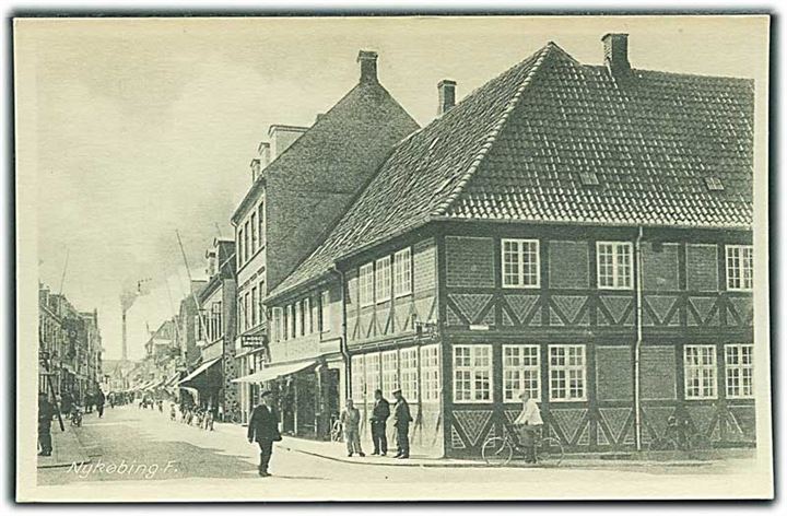 Gadeparti i Nykøbing F. Rudolf Olsens Kunstforlag no. 1756.