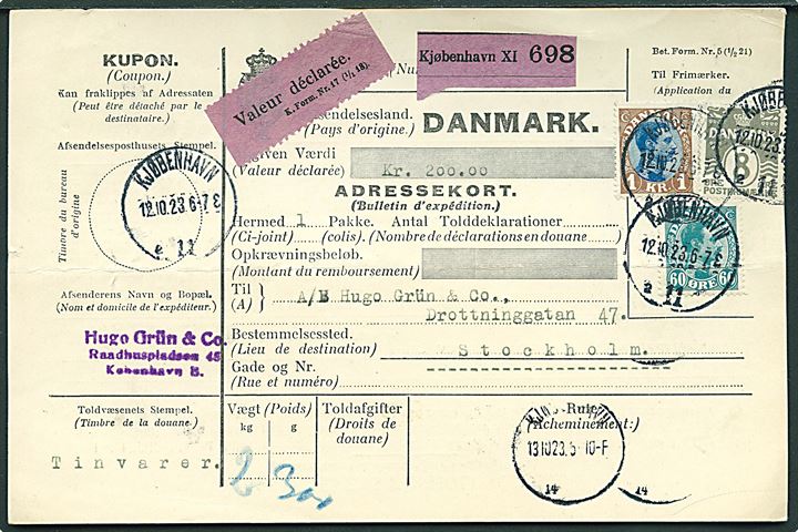 8 øre Bølgelinie, 60 øre og 1 kr. Chr. X på internationalt adressekort for værdipakke fra Kjøbenhavn d. 12.10.1923 til Stockholm, Sverige.