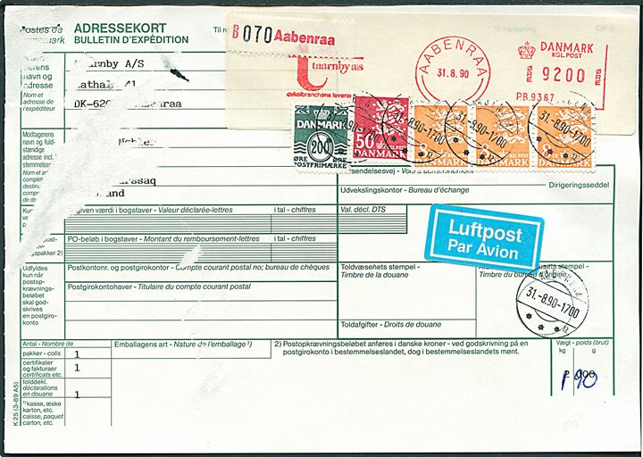 92 kr. firmafranko på adressekort for luftpostpakke op-frankeret med 200 øre Bølgelinie (skade), 8 kr. (3) og 50 kr. Rigsvåben annulleret m. sjældent brotype IId stempel Aabenraa *** sn12 d. 31.8.1990 til Grønland. Stempel ikke registreret postalt anvendt af Vagn Jensen.