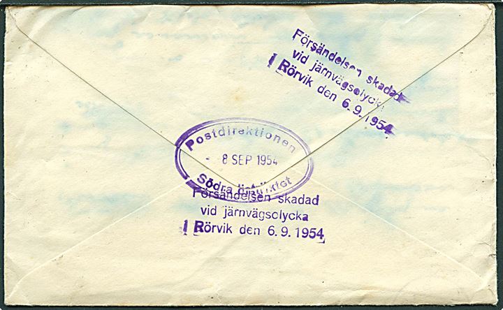 Beskadiget brev fra Sutton d. 4.9.1954 til Södertälje, Sverige. På bagsiden stemplet: Försändelsen skadad vid järnvägsolycka i Rörvik den 6.9.1954 og ovalt Post-direktionen Södra Distriktet d. 8.9.1954.