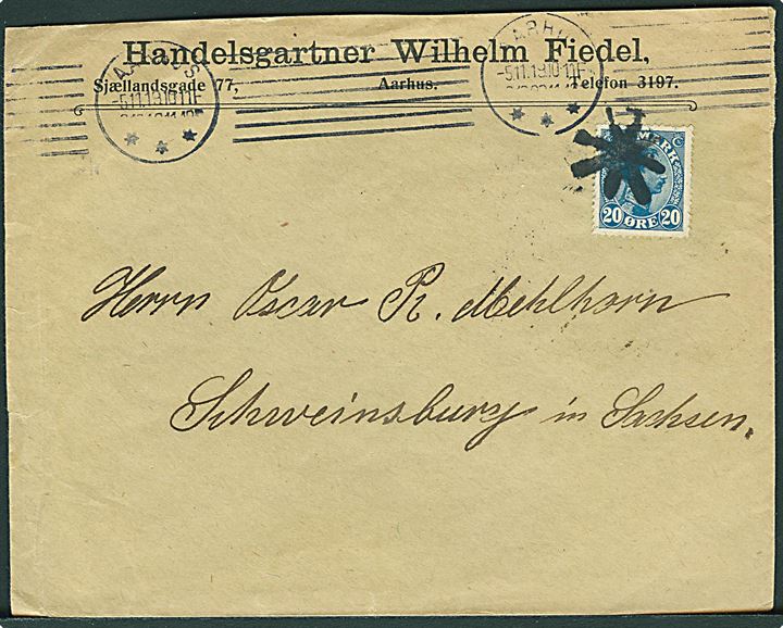 20 øre Chr. X single på brev fra Aarhus d. 5.11.1919 til Schweinsburg, Tyskland. Frimærke ikke ramt af maskin-stempel i Aarhus og annulleret ved ankomsten med sort stumt stjernestempel. Interessant.