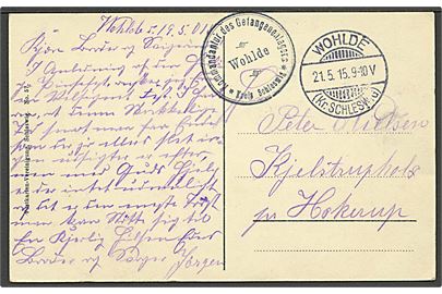 Ufrankeret feltpostkort stemplet Wohlde (Kr. Schleswig) d. 21.5.1915 til Hjelstrupholz pr. Hockerup. Briefstempel Kommandantur des Gefangenenlagers Wohlde. Fra sønderjyde, skrevet på dansk. 