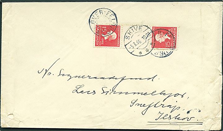 15 øre H. C. Andersen i tête-bêche 3-stribe med mellemstykke på brev annulleret med udslebet stjernestempel OVER-FELDBORG og sidestemplet Skive d. 5.3.1936 til Ilskov. Kuvert skåret i toppen.