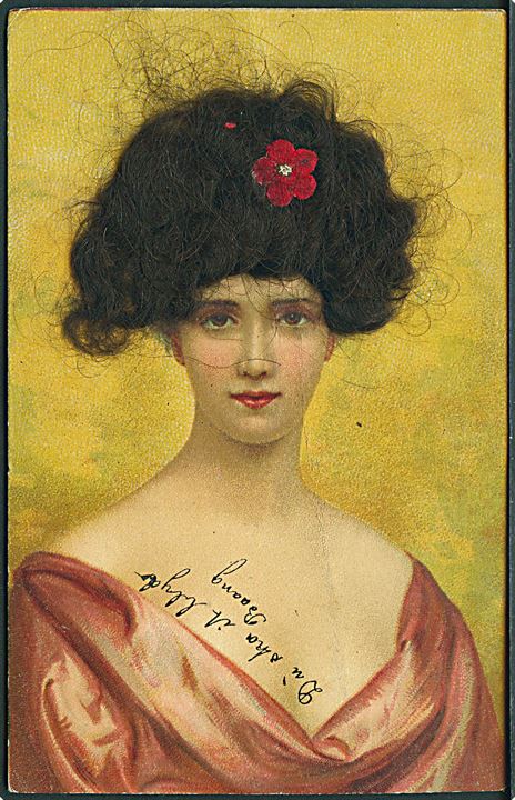 Kvinde iført rødlig overdel. Ægte hår påsat. A. G. M. no. 5005.
