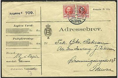 10 øre Fr. VIII (2) på adressebrev for pakke fra Nykjøbing Falster d. 10.2.1911 til Odense.