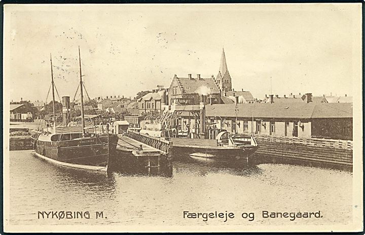 Nykøbing M., Færgeleje med færgen “Masnedsund” og Banegaard. Stenders no. 2223.  Kvalitet 7