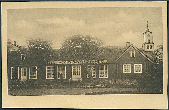Thorshavn, “H. N. Jacobsens Boghandel” med kirke i baggrunden. U/no. Kvalitet 8