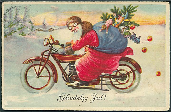 Glædelig Jul. Julemand iført rød kåbe, kører på motorcykel. U/no. 