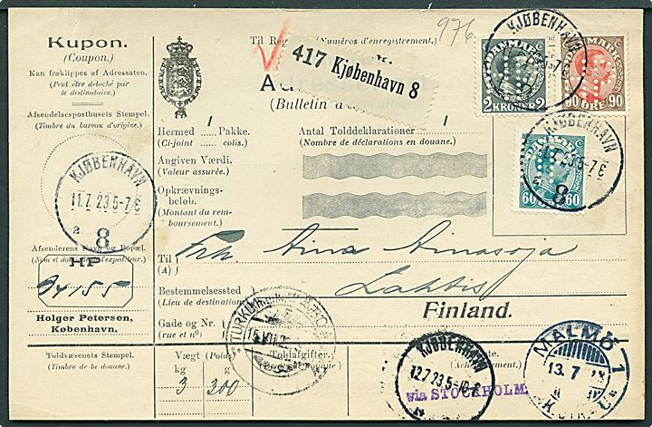 60 øre, 90 øre og 2 kr. Chr. X med perfin HP på internationalt adressekort for pakke fra firma Holger Petersen stemplet Kjøbenhavn 8 d. 11.7.1923 via Malmö og Turku til Lahti, Finland.