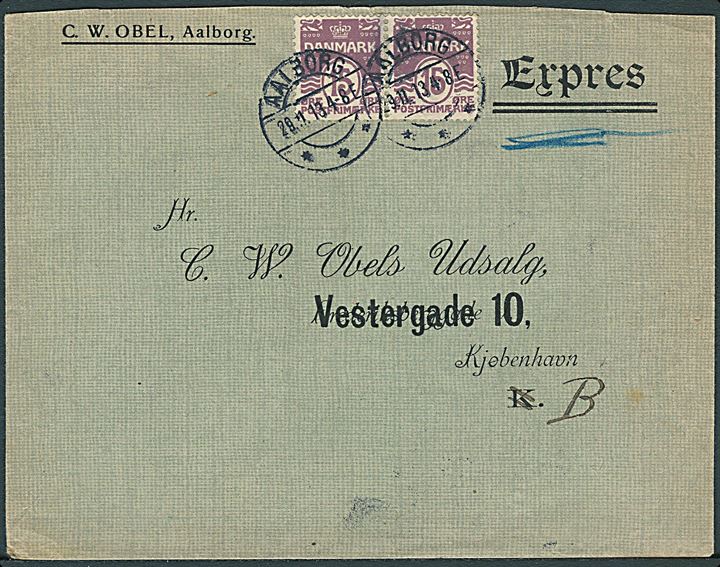 15 øre Bølgelinie i parstykke på fortrykt ekspresbrev fra firma C.W.Obel i Aalborg d. 29.11.1913 til Kjøbenhavn. På noteret: “Forsøgt afleveret kl. 9 1/4”. Bagklap mgl.