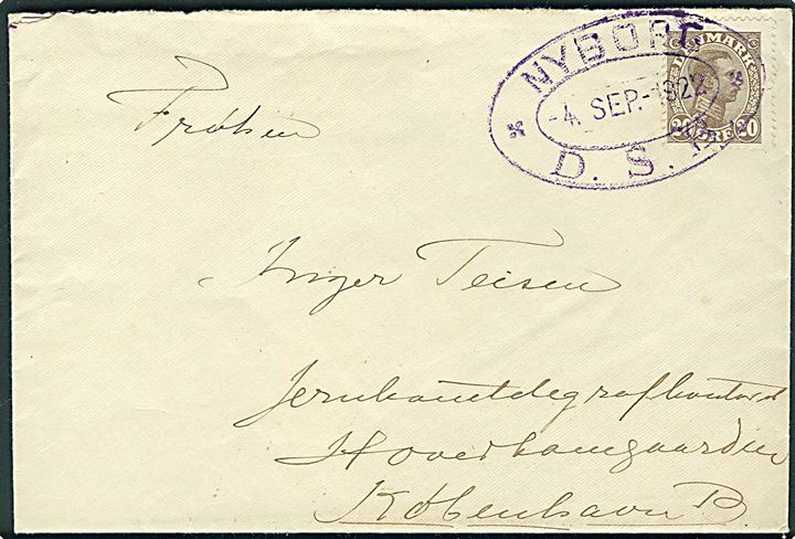 20 øre Chr. X på brev annulleret med violet jernbane-stempel NYBORG / * D.S.B. * d. 4.9.1922 til Jernbane-telegrafkontoret, Hovedbanegaarden, København. Meget dekorativ forsendelse.