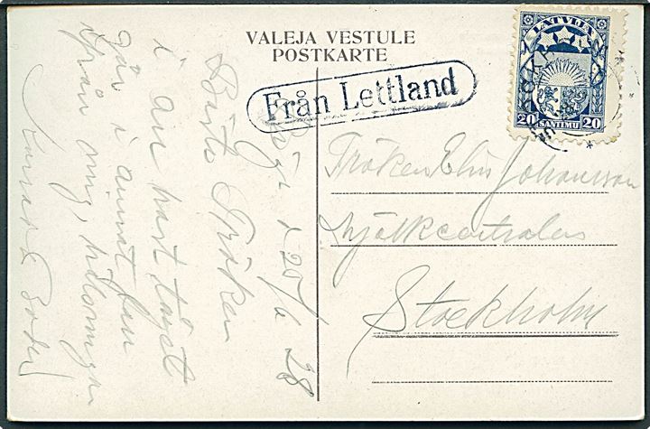 Letland 20 s. Våben på brevkort dateret Riga d. 20.6. 1928 annulleret med svensk stempel i Stockholm 28.6. 1928 og sidestemplet med skibsstempel “Från Letland” til Stockholm, Sverige. Sjælden skibspost. 