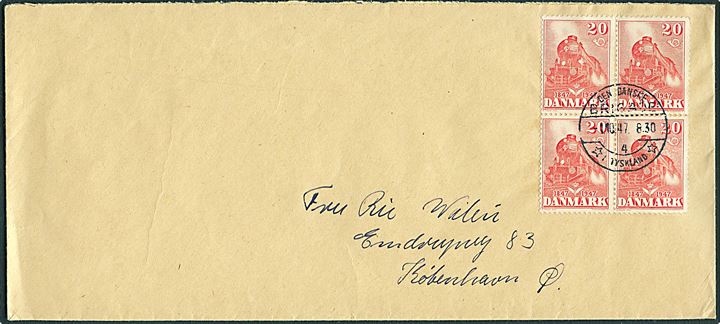20 øre DSB Jubilæum i fireblok på aflang kuvert fra Værkstedsdeling III annulleret Den danske Brigade / 4 / * i Tyskland * d. 1.10.1947 til København. Sendt fra den danske forlægning i Varel.